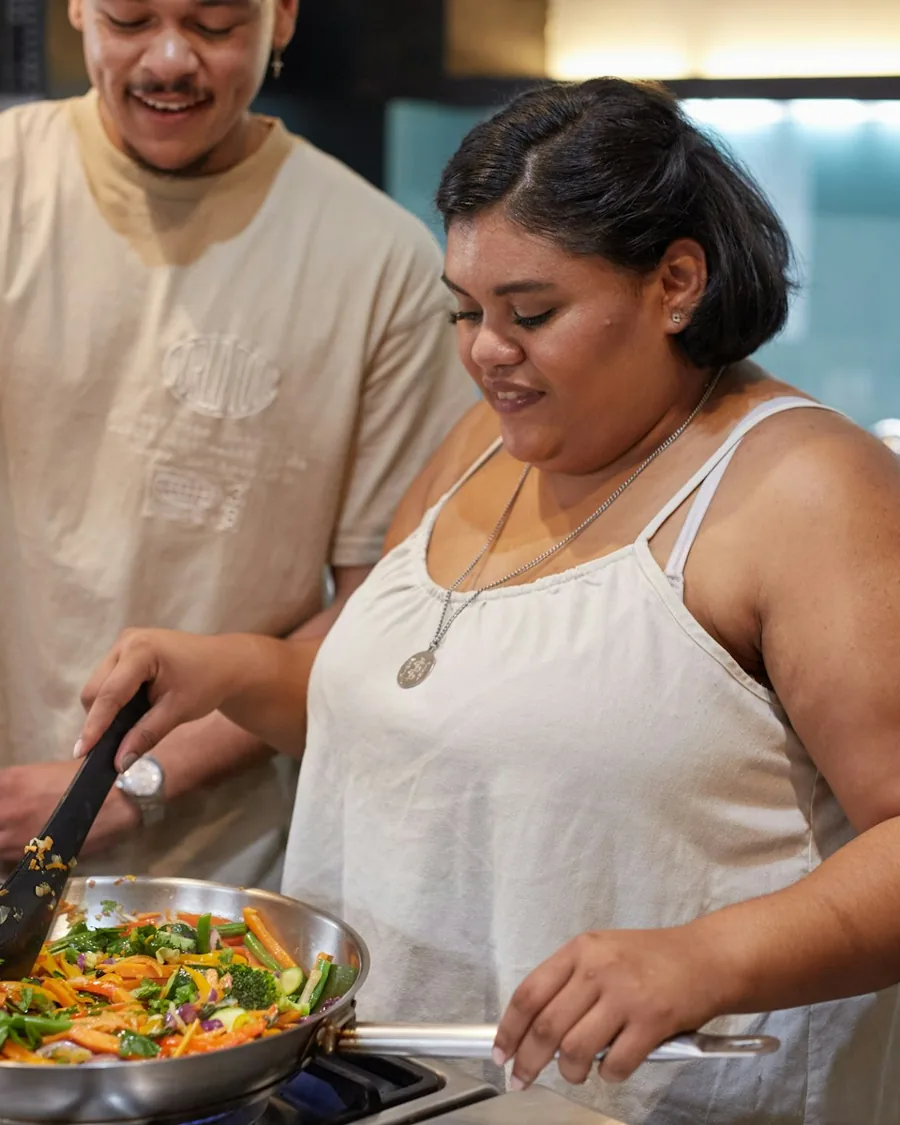 A couple preparing fresh vegetables together in their kitchen